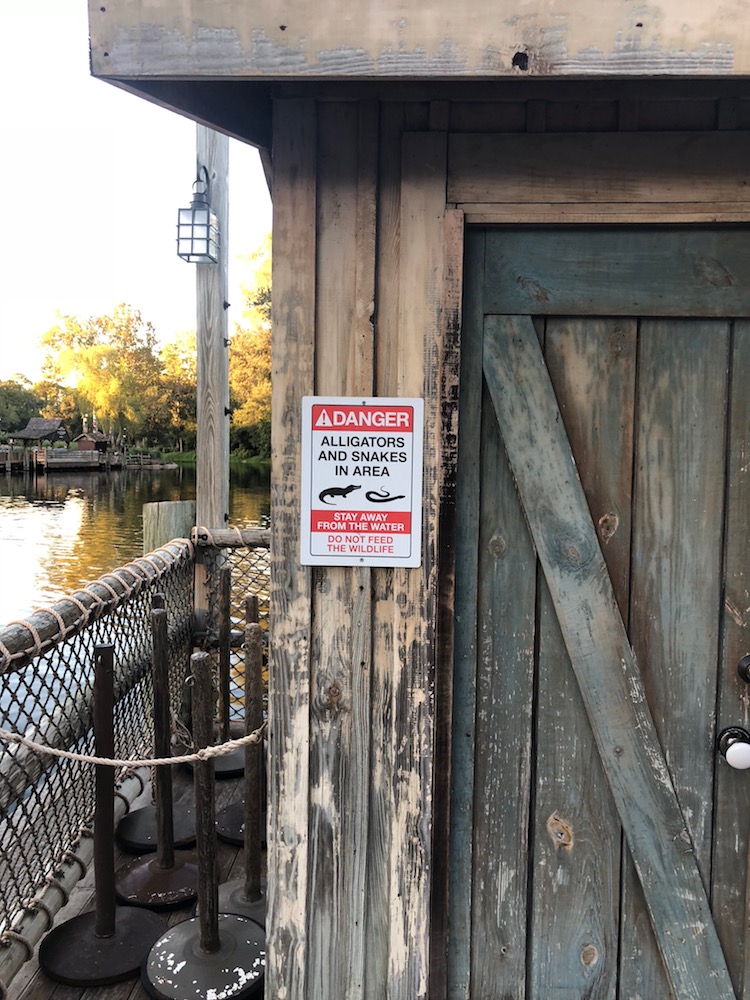 Magic Kingdom warning sign about snakes and alligators